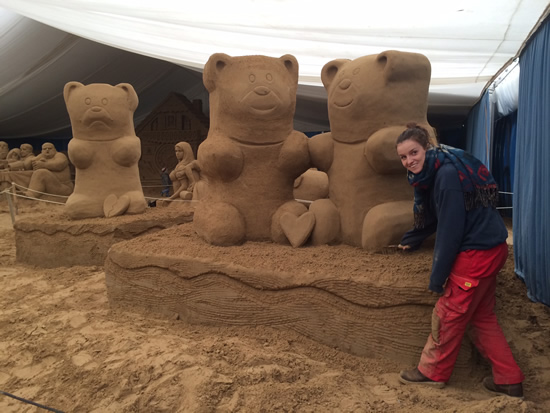 Claire Jamieson finishing gummy bear sand sculpture