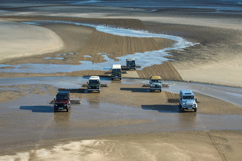 The puddles and streams were no match for the Defenders. Image courtesy of Land Rover