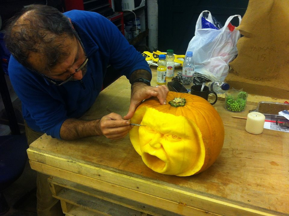 Yad making the finishing touches to one of the pumpkin carvings, just in time for Halloween