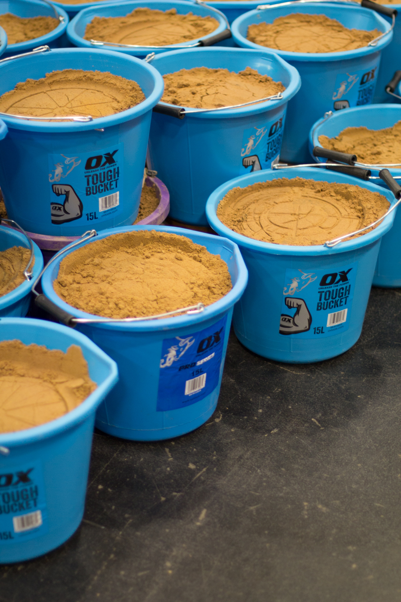 Buckets of sand ready to be used at the trade show event