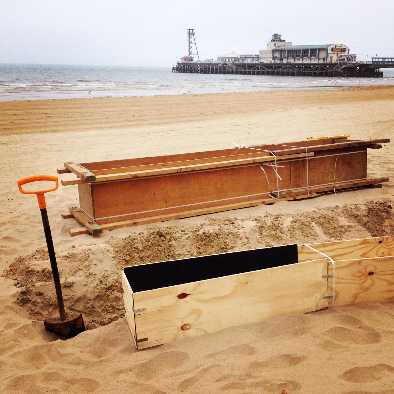 Compaction begins on the beach sand sculptures