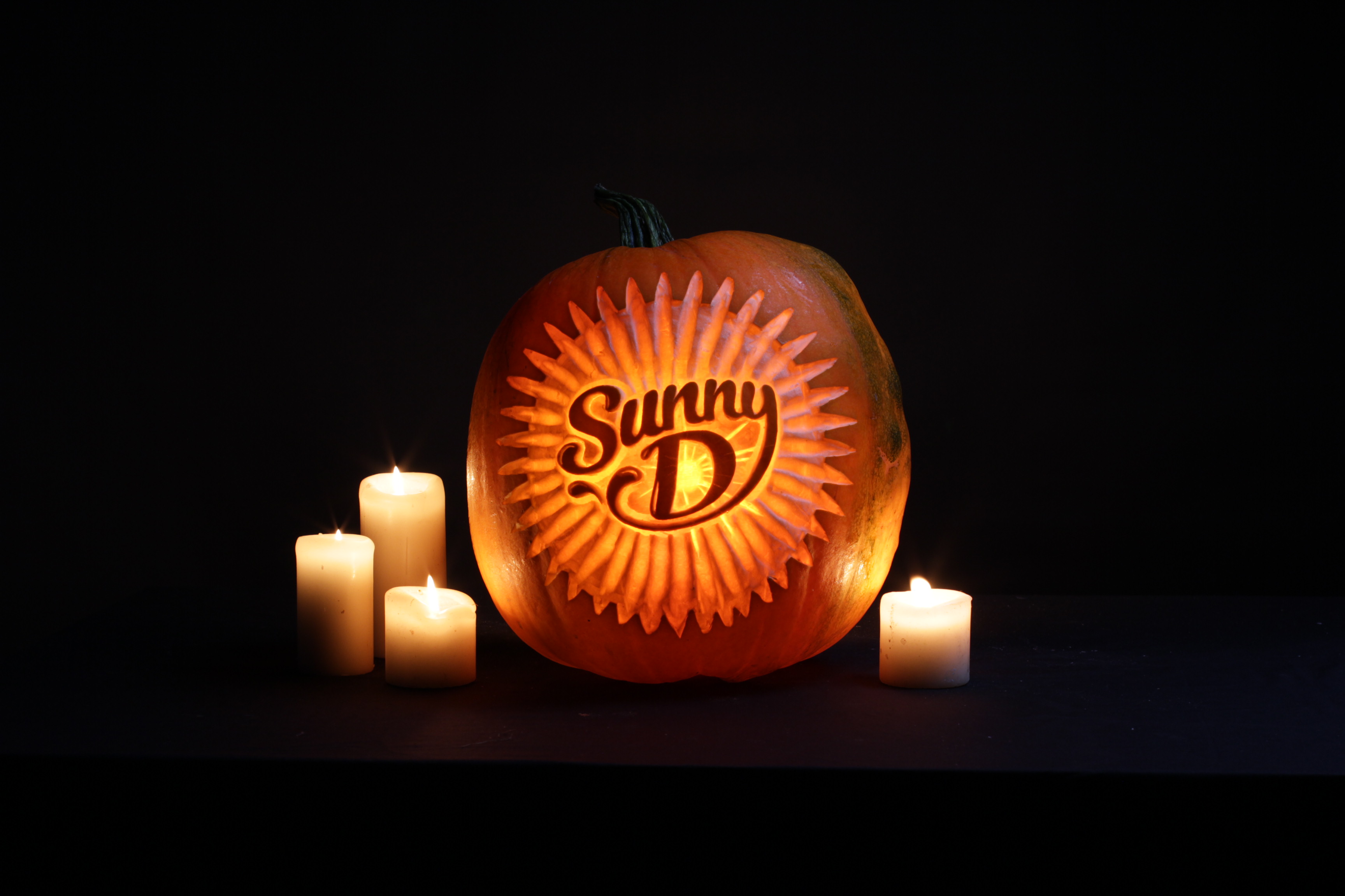 Sand In Your Eye pumpkin carvers create logo pumpkin carving