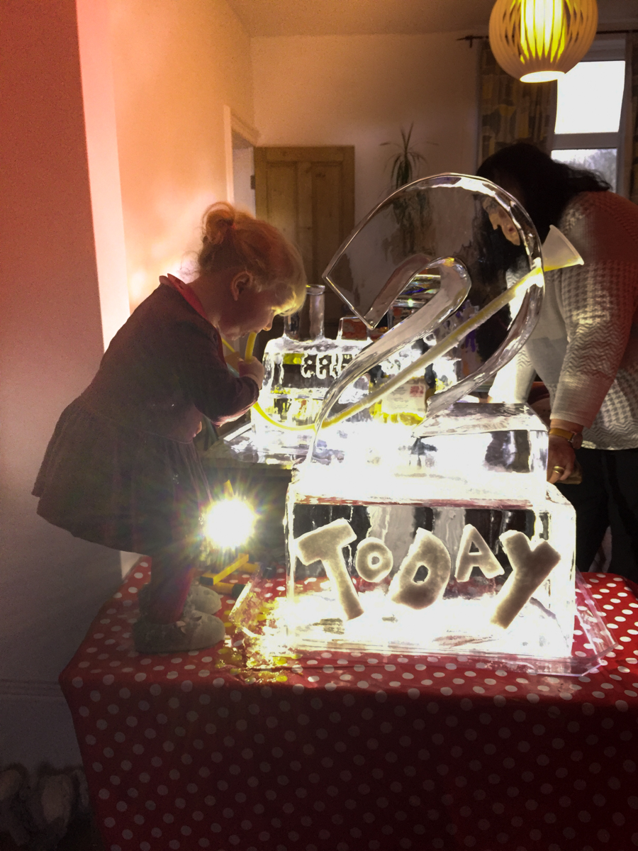 Florence enjoying her ice luge at her birthday party