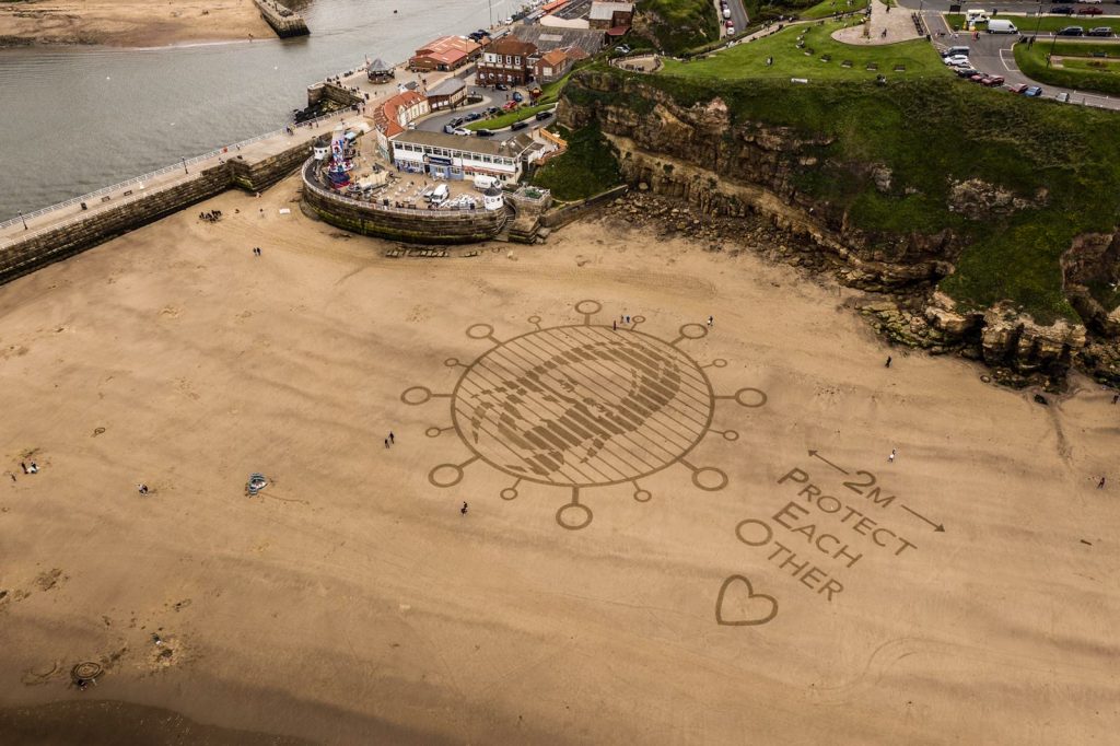 Social distancing sand drawing whitby
