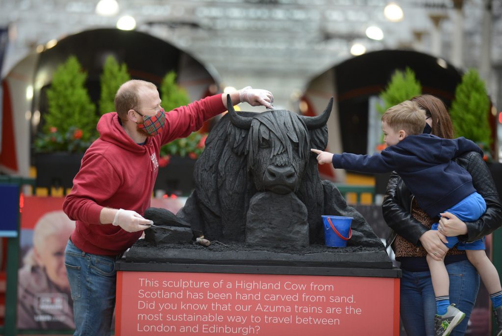 Sculpture of Tyne Bridge unveiled at Newcastle Central Station as part of a series highlighting the environmental credentials of train travel as staycations boom.